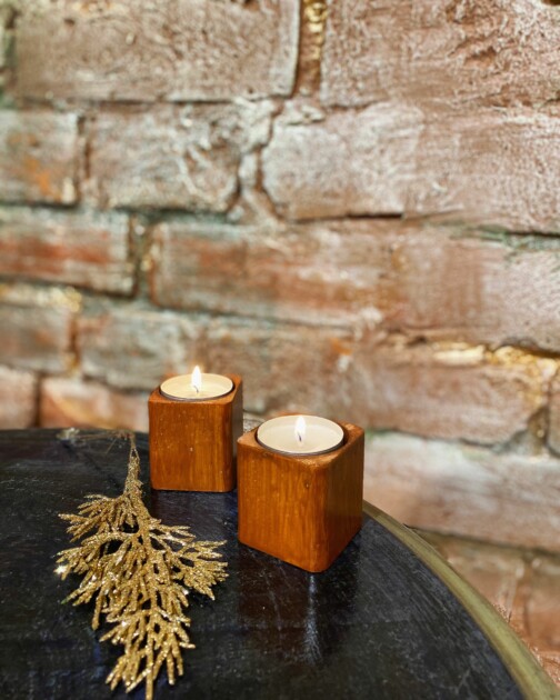 square wood candle holder on table