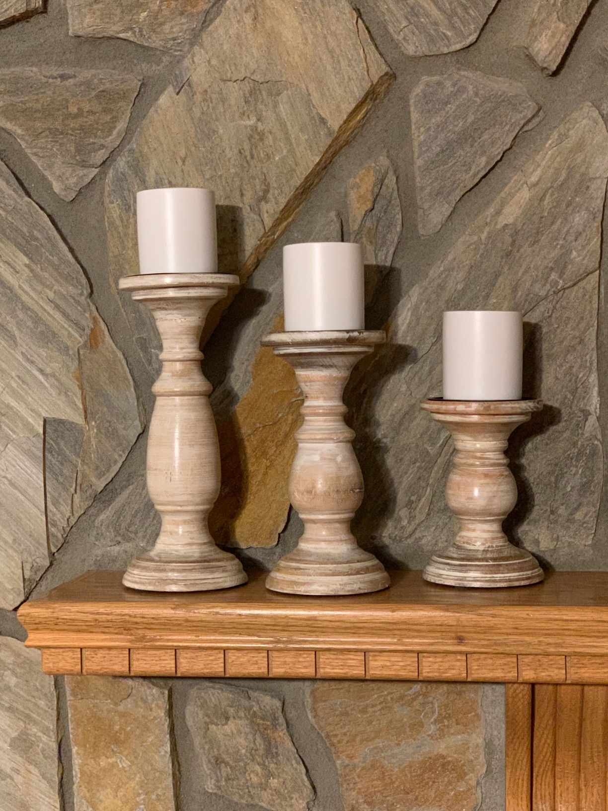 wooden candle holders rock wall